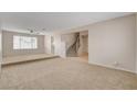 Spacious living room with staircase access to the second level at 7004 Powderhorn Cir, Las Vegas, NV 89128