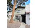 Quaint townhome showcasing a covered entryway and low-maintenance landscaping at 854 Stainglass Ln, Las Vegas, NV 89110