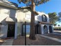 Charming townhouse featuring a unique architectural style and desert landscaping at 854 Stainglass Ln, Las Vegas, NV 89110