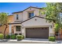 Charming two-story home with a well-manicured lawn and a two-car garage at 10353 Yew Blossom Ave, Las Vegas, NV 89166