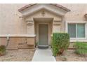Front entrance with well maintained landscaping and neutral paint at 1150 Red Margin Ct # 101, Las Vegas, NV 89183