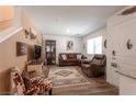 Spacious living room featuring stylish decor and wood-style flooring, creating a warm ambiance at 12348 Golden Wreath Rd # 1, Las Vegas, NV 89183