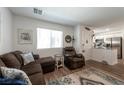 Comfortable living room with wood-style floors, perfect for relaxing and entertaining guests at 12348 Golden Wreath Rd # 1, Las Vegas, NV 89183