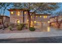 Beautiful home with stone accents, well-manicured landscaping and three-car garage at 2124 Pont National Dr, Henderson, NV 89044
