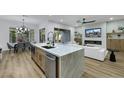 Spacious open kitchen featuring a large island, modern appliances, and seamless flow to living area at 2873 Knoxville Ct, Henderson, NV 89052