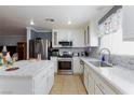 Well-equipped kitchen featuring sleek countertops and stainless steel appliances at 3404 Brayton Mist Dr, North Las Vegas, NV 89081