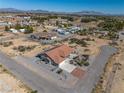 Expansive aerial view of a desert property with lush landscaping and a charming home at 3430 Flagstone Ct, Pahrump, NV 89048