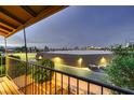 Balcony view of Las Vegas building and street at dusk with a metal railing at 3942 Delos Dr, Las Vegas, NV 89103