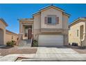 Charming home with a two-car garage and a welcoming front entrance at 4507 Grotto Ct, North Las Vegas, NV 89031