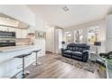 Cozy living room with natural light, breakfast bar, and comfortable seating arrangement at 515 Kristin Ln, Henderson, NV 89011