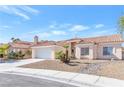 A charming single-story home with desert landscaping, two-car garage, and well-maintained front yard at 5513 Escallonia St, Las Vegas, NV 89149