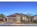 Charming single-story home with a two-car garage, stone accents, and a well-maintained front yard at 617 Sylvan St, Henderson, NV 89002
