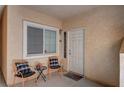 Cozy front porch with seating area and a 'Welcome' mat, inviting guests into the home at 689 Bay View Dr # 1311, Boulder City, NV 89005