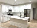 Modern kitchen showcasing sleek white countertops, stainless steel appliances, and stylish fixtures at 7615 Paso Robles Ave, Las Vegas, NV 89113