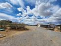 Expansive lot showing the desert landscape and a small home at 781 Buol Rd, Pahrump, NV 89048
