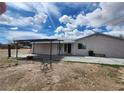 Backyard showing a covered patio area with house at 781 Buol Rd, Pahrump, NV 89048