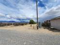 View of the yard, outbuildings, and landscape at 781 Buol Rd, Pahrump, NV 89048