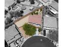 Aerial view of a home showcasing the backyard, landscaping, and surrounding neighborhood at 8682 Gateway Glen Dr, Las Vegas, NV 89178