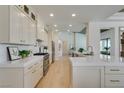 Spacious kitchen with stainless steel appliances, white cabinets, and quartz countertops at 9425 Villa Ridge Dr, Las Vegas, NV 89134