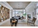 Bright living room with fireplace, stylish shelving, and an abundance of natural light at 9425 Villa Ridge Dr, Las Vegas, NV 89134