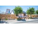 Inviting single-story home with a metal roof, modern fence, and desert-friendly landscaping at 108 Verdy Ln, Las Vegas, NV 89101