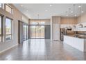 Bright living space with large windows and sliding glass doors, seamlessly blending indoor and outdoor living at 10985 Limeslice Ave # 2, Las Vegas, NV 89135