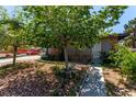 Landscaped front yard showcases a quaint home with stone and brick, offering curb appeal at 201 Cervantes St, Las Vegas, NV 89101