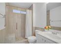 Bathroom with walk-in shower and white vanity offers a clean, modern feel at 236 Dog Leg Dr, Las Vegas, NV 89148