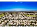Expansive aerial view of a residential neighborhood showcasing the layout and community at 2413 Mourning Warbler Ave, North Las Vegas, NV 89084