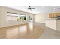 Bright living room with an open floor plan featuring backyard access at 2538 Capella Star St, Henderson, NV 89044