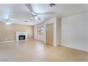 Spacious living room with a fireplace and a neutral color palette at 411 Monmouth Ct, Henderson, NV 89015