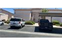 Community parking lot featuring a covered parking area, with several cars at 4555 Sahara Ave # 252, Las Vegas, NV 89104