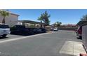 View of community parking lot with covered parking and assigned spots at 4555 Sahara Ave # 252, Las Vegas, NV 89104