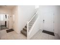 Inviting foyer with tile flooring, a staircase, and a bright, clean aesthetic at 4652 Wyncrest Ave, Las Vegas, NV 89115