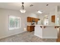 Bright kitchen with light wood cabinetry, laminate countertop, and updated appliances at 4904 Wiltondale Way, Las Vegas, NV 89130