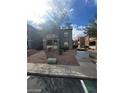 Two story apartment building exterior with well maintained landscaping at 555 E Silverado Ranch Blvd # 1123, Las Vegas, NV 89183