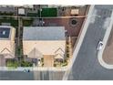 Aerial view of property featuring a private backyard, driveway, and professional landscaping at 7002 Fossil Rim St, North Las Vegas, NV 89084