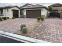 Charming single-story home featuring a three-car garage and beautifully paved driveway at 7265 Southern Magnolia St, Las Vegas, NV 89149