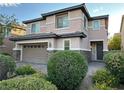 Lovely two-story home showcasing desert landscaping, brick driveway, and attached two-car garage at 7325 Perkins Hill St, Las Vegas, NV 89166