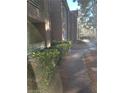 Exterior showcasing the building's architecture with landscaped walkway, ideal for enjoying community spaces at 7730 Secret Shore Dr # 207, Las Vegas, NV 89128