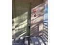 Close-up of the entrance door of unit 207, featuring a secure lock system and a doormat for a clean entrance at 7730 Secret Shore Dr # 207, Las Vegas, NV 89128
