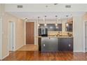 Open-concept kitchen featuring a breakfast bar, granite countertops and stainless appliances at 8255 Las Vegas Blvd # 117, Las Vegas, NV 89123