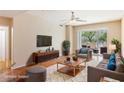 Comfortable living room with a stylish couch, hardwood floors, and sliding glass doors to a patio at 8255 Las Vegas Blvd # 117, Las Vegas, NV 89123