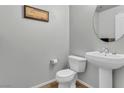 Well-lit half bath features a modern sink and toilet, offering a clean and functional space at 8255 Las Vegas Blvd Blvd # 719, Las Vegas, NV 89123