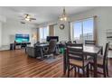 Spacious living room features wood floors, a ceiling fan, and large windows with city views at 8255 Las Vegas Blvd Blvd # 719, Las Vegas, NV 89123