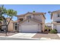 Charming two-story home featuring desert landscaping and a tile roof at 829 Dancing Vines Ave, Las Vegas, NV 89183