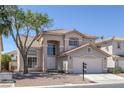 Charming two-story home featuring desert landscaping and a tile roof at 829 Dancing Vines Ave, Las Vegas, NV 89183