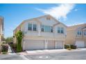 Multi-Gathering home featuring a three-car garage and stucco facade in a residential community at 9322 Straw Hays St # 103, Las Vegas, NV 89178
