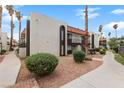 Charming condo complex exterior with well-maintained landscaping and inviting walkways at 1405 Vegas Valley Dr # 98, Las Vegas, NV 89169