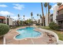 Community pool offers a great recreational space surrounded by lush palm trees and well kept landscaping at 1405 Vegas Valley Dr # 98, Las Vegas, NV 89169